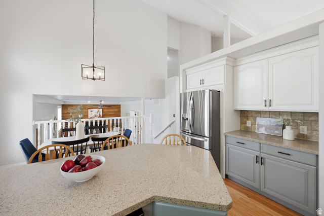 3732 Campbell Road Tooele, UT 84074 - Photo 13 of 69 Kitchen island featuring a light-colored solid surface countertop