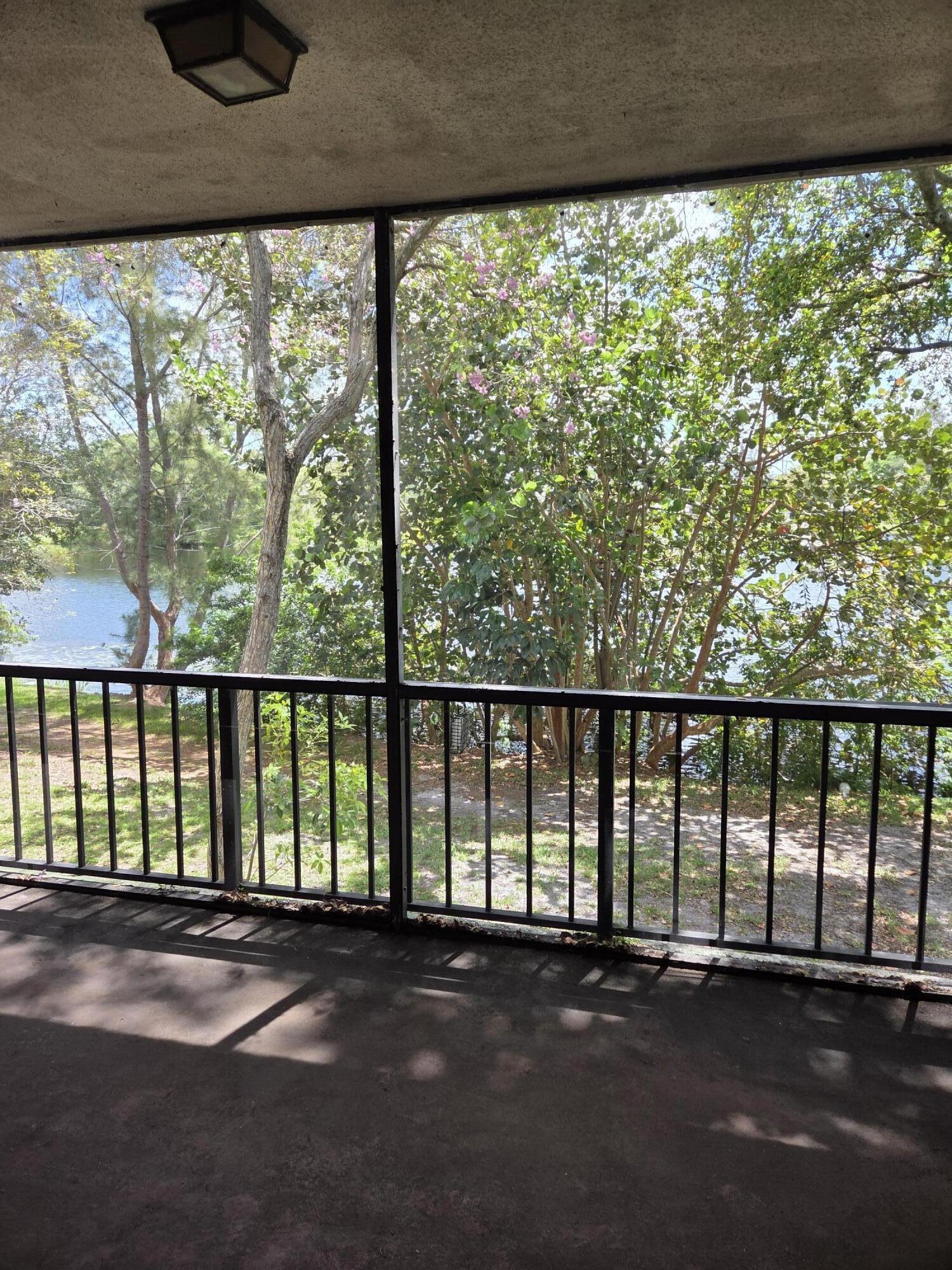 3720 Inverrary Drive, Unit 2B Lauderhill, FL 33319 - Photo 2 of 10 a view of empty room with wooden floor and windows