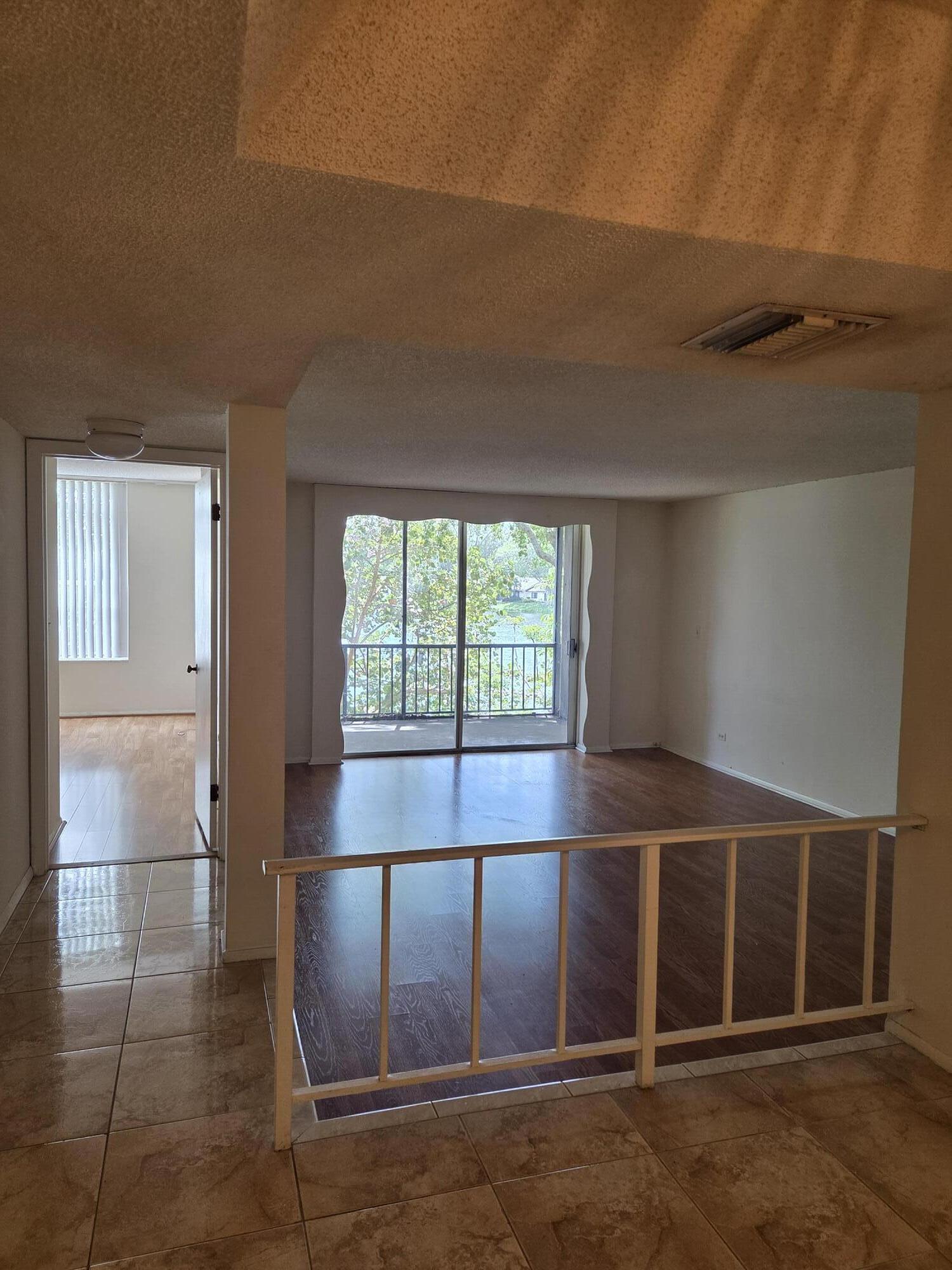 3720 Inverrary Drive, Unit 2B Lauderhill, FL 33319 - Photo 8 of 10 a view of an empty room with a window