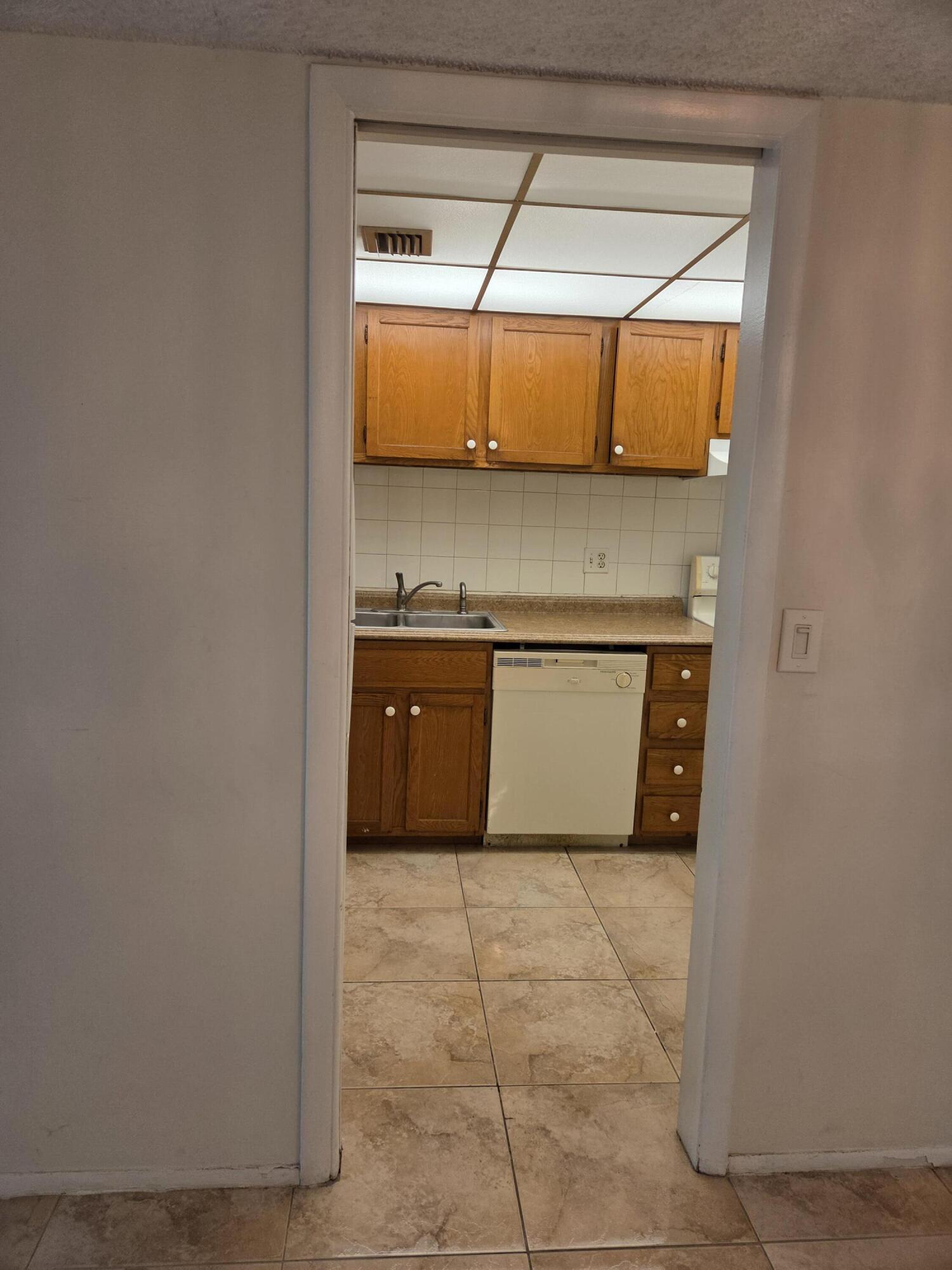 3720 Inverrary Drive, Unit 2B Lauderhill, FL 33319 - Photo 10 of 10 a kitchen with a cabinets and a sink