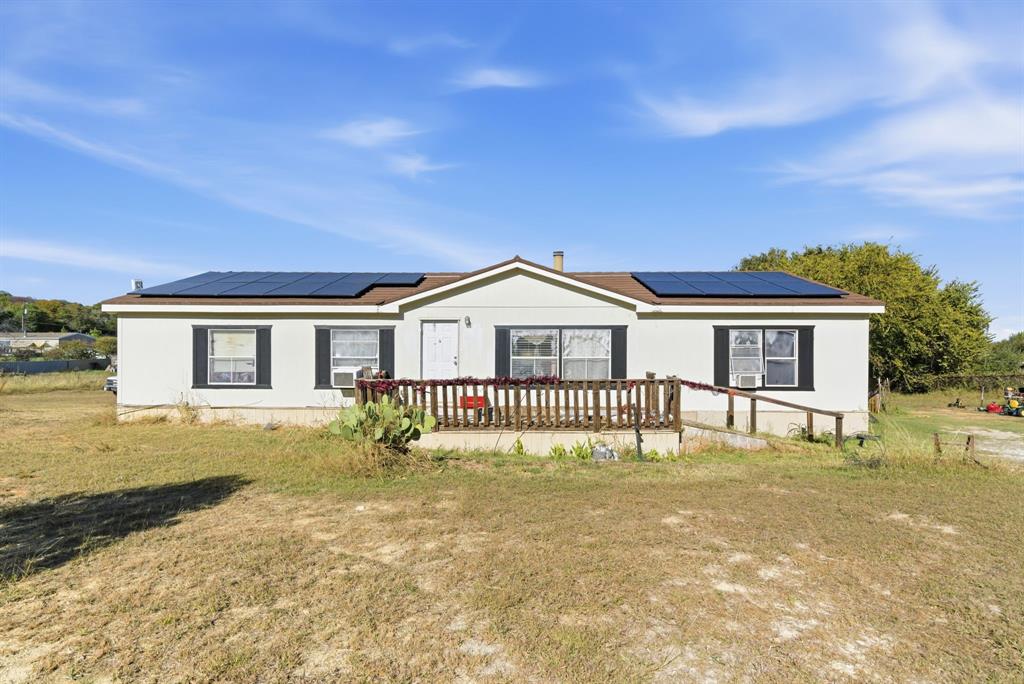 406 Hilltop Meadows Court Springtown, TX 76082 - Photo 1 of 33 a view of a house with a yard