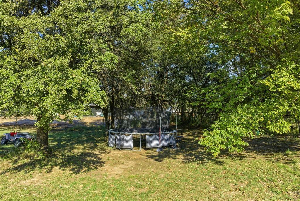 406 Hilltop Meadows Court Springtown, TX 76082 - Photo 12 of 33 a view of a house with a yard