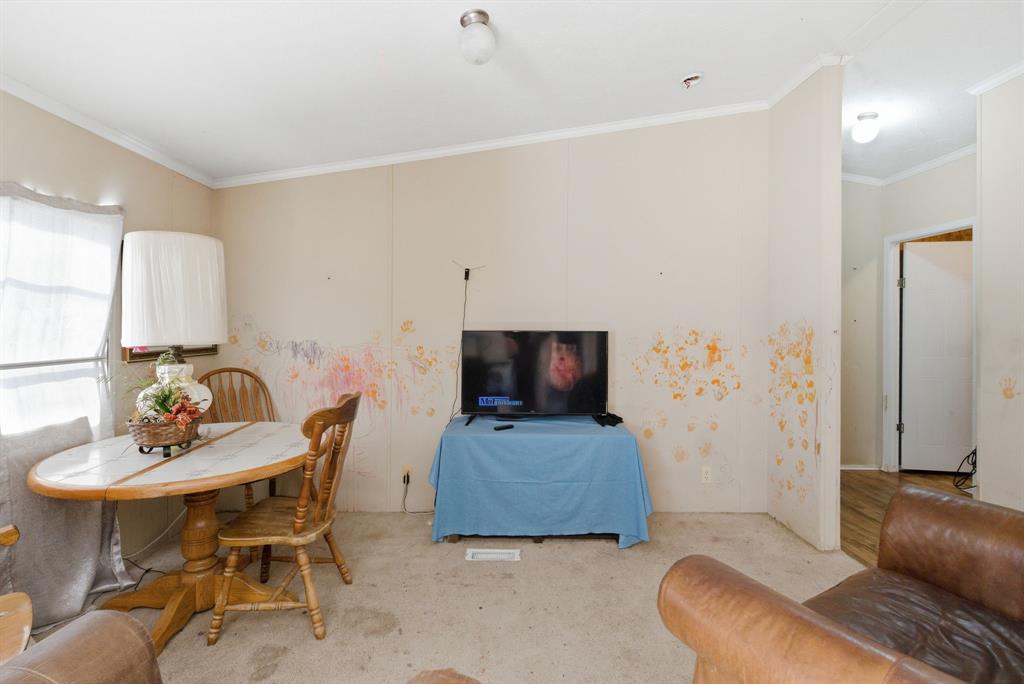 406 Hilltop Meadows Court Springtown, TX 76082 - Photo 16 of 33 a living room with furniture and a flat screen tv