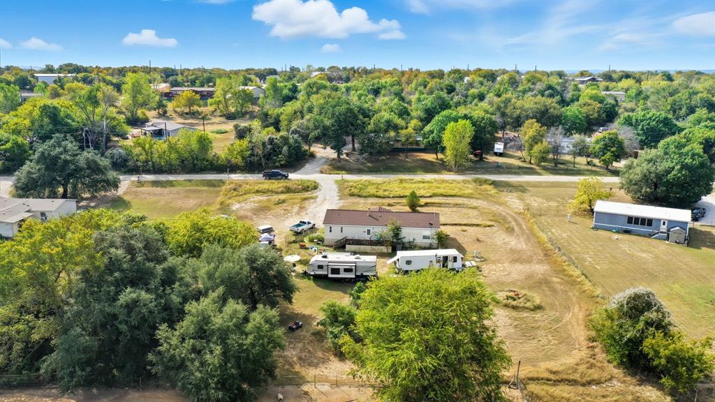 406 Hilltop Meadows Court Springtown, TX 76082 - Photo 9 of 33 a view of a swimming pool with an outdoor seating and yard