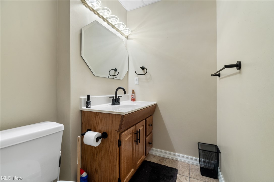 53330 High Ridge Road Bridgeport, OH 43912 - Photo 26 of 34 Bathroom with vanity, toilet, and tile floors