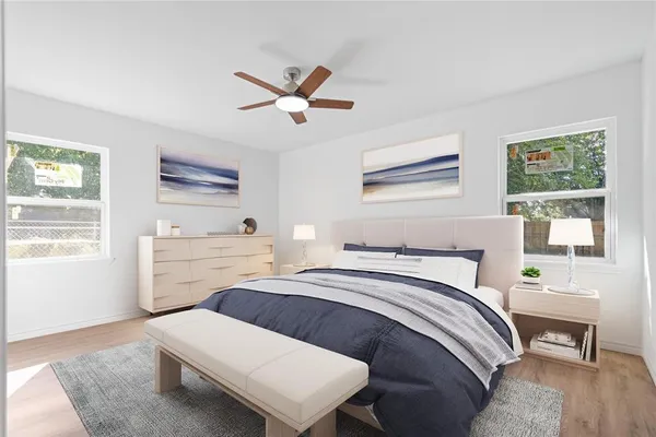 a bedroom with a bed and a window