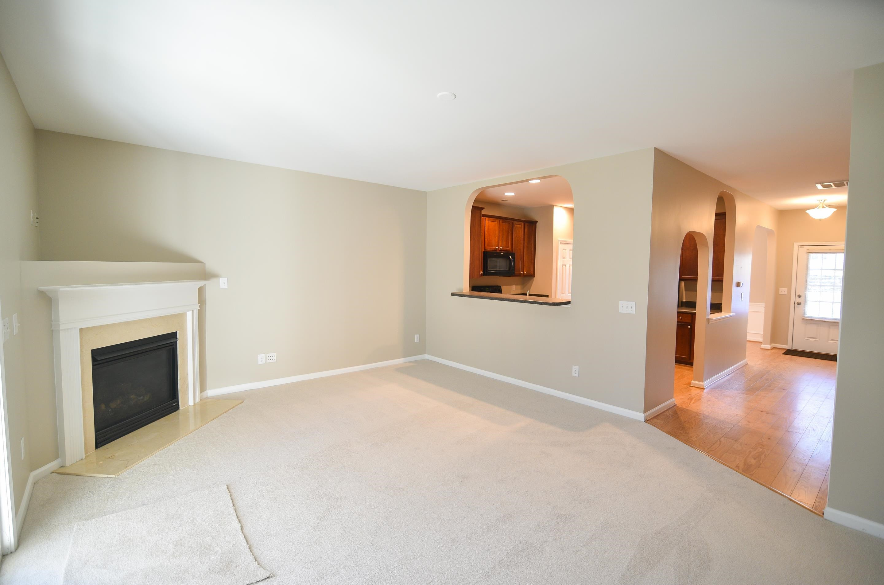 Charming fireplace will keep you cozy on chilly nights! Living Room