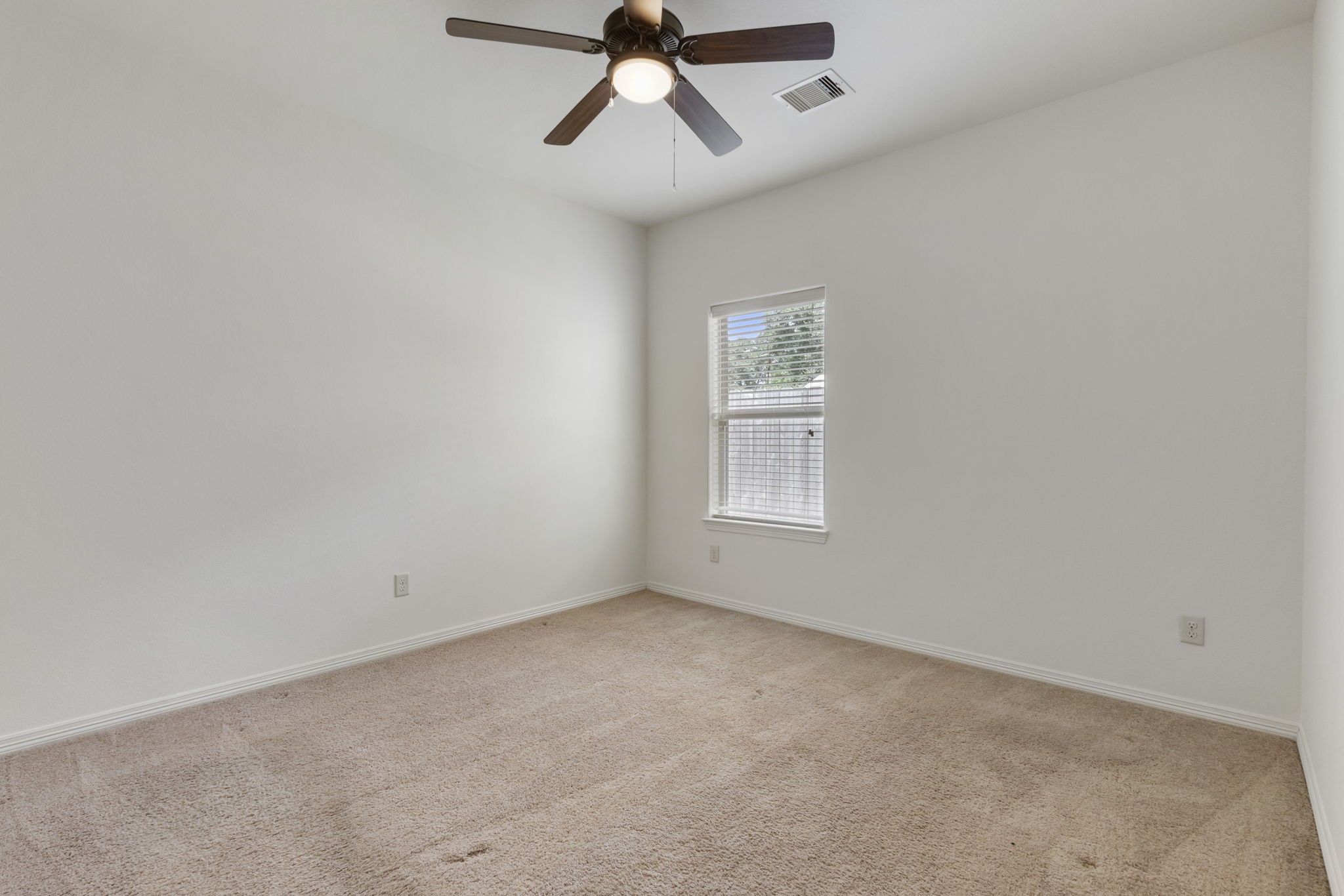 23911 Augusta Falls Lane Spring, TX 77389 - Photo 26 of 40 an empty room with a window and a ceiling fan