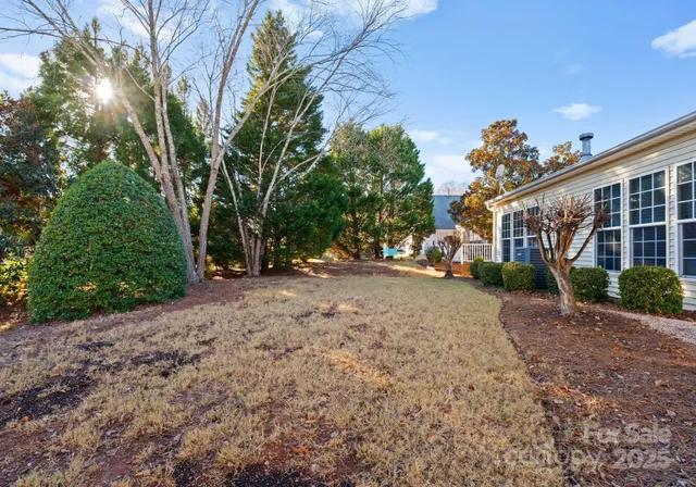 a view of a house with a yard and garage