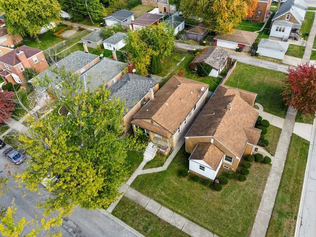 an aerial view of a house with a garden