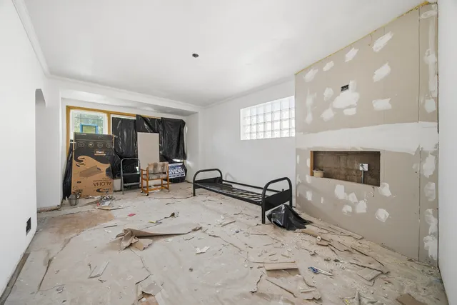 a room with gym equipment and a window