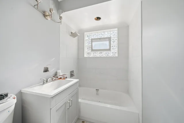 a bathroom with a sink and a bathtub