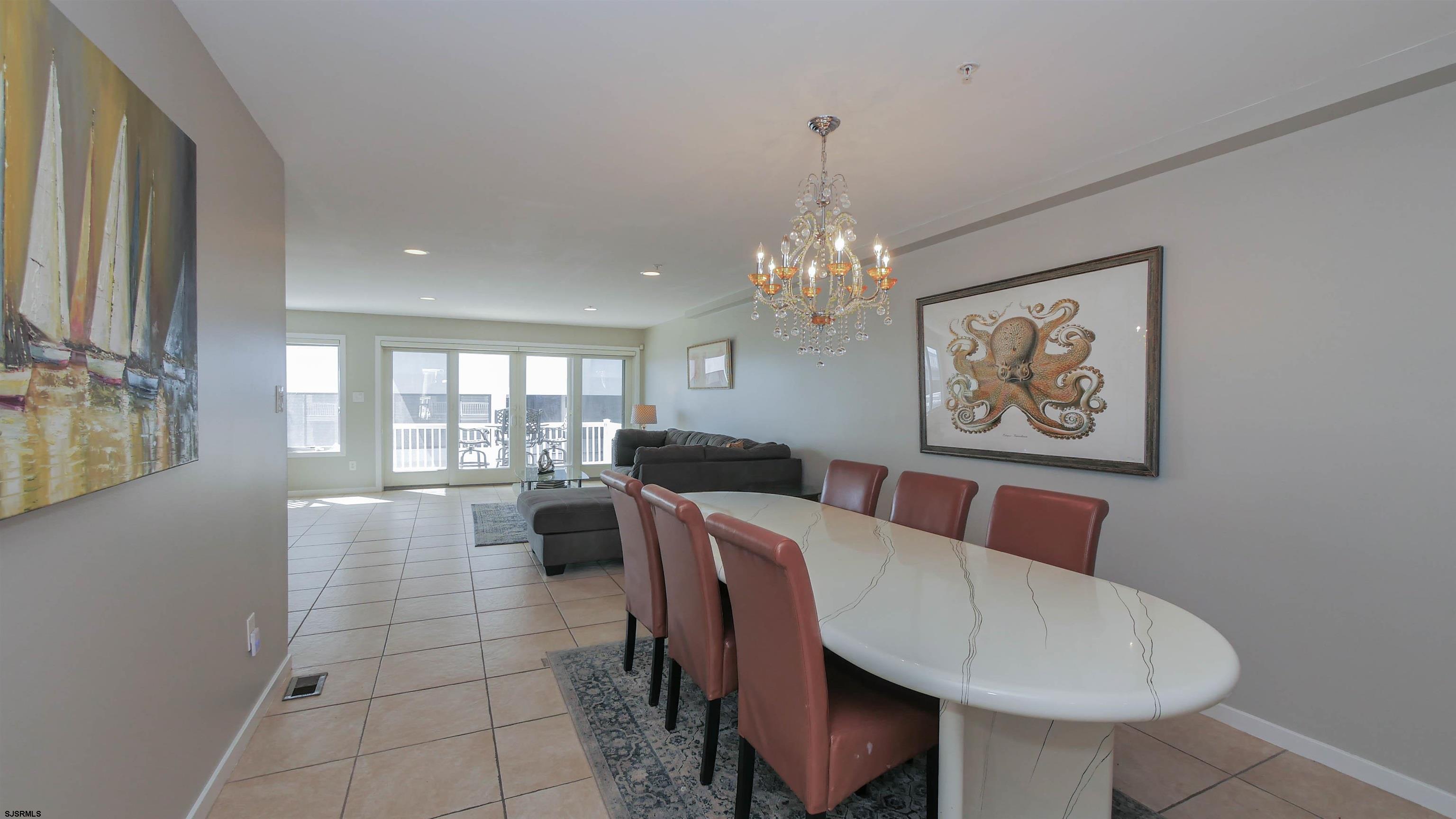 137 South Berkley Square, Unit B Atlantic City, NJ 08401 - Photo 14 of 42 a view of a dining room with furniture and chandelier