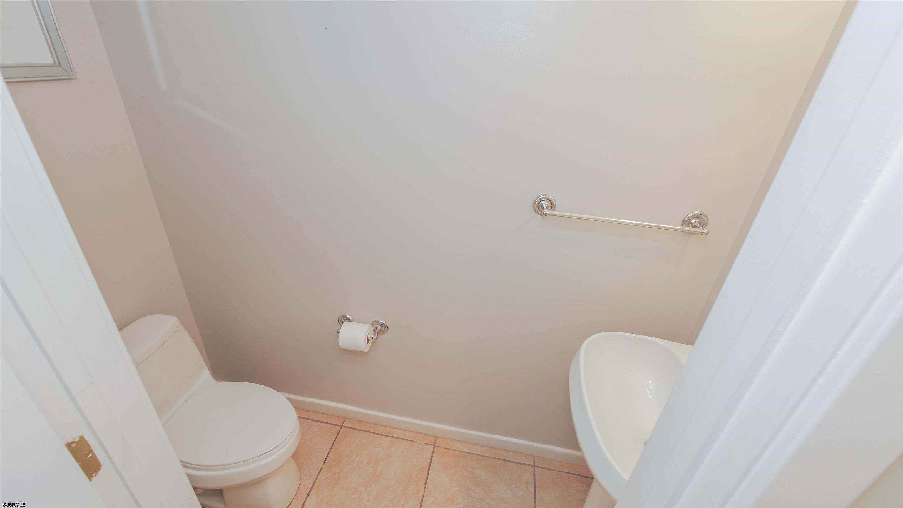 137 South Berkley Square, Unit B Atlantic City, NJ 08401 - Photo 20 of 42 a white toilet sitting next to a sink