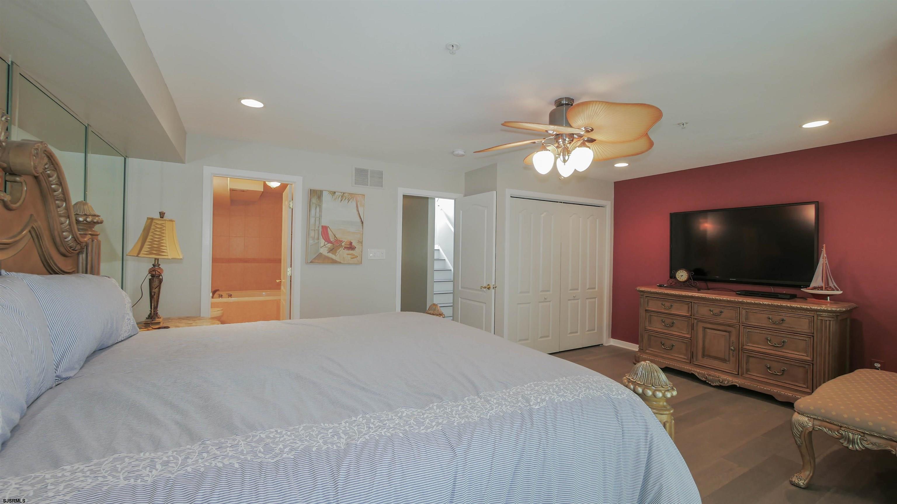 137 South Berkley Square, Unit B Atlantic City, NJ 08401 - Photo 24 of 42 a bedroom with a bed and a flat screen tv
