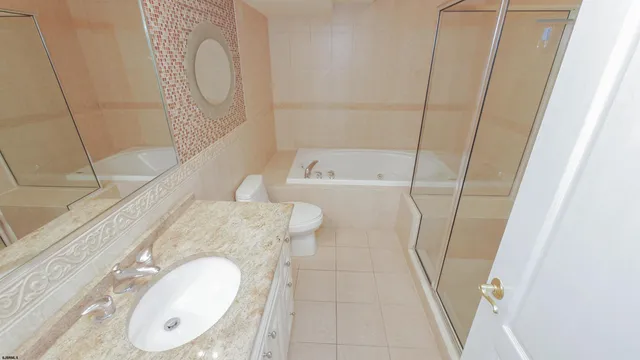 a bathroom with a sink vanity and mirror