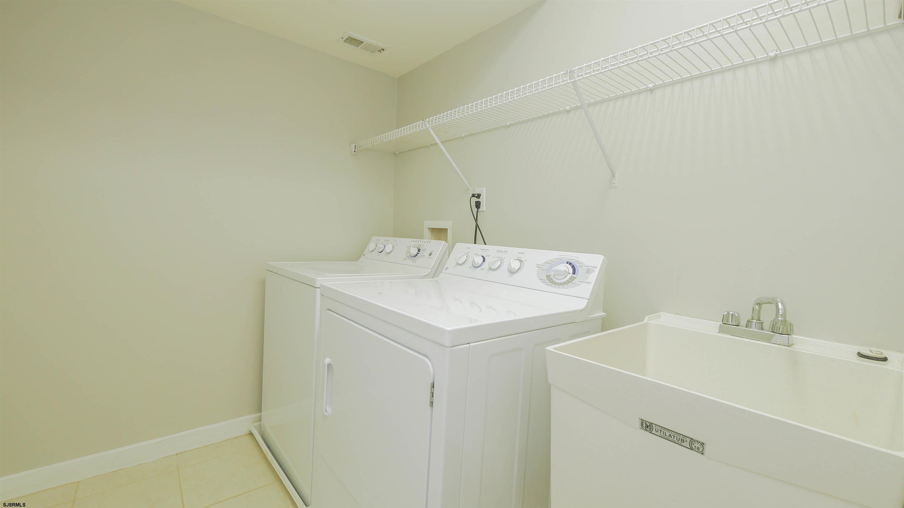 137 South Berkley Square, Unit B Atlantic City, NJ 08401 - Photo 30 of 42 a utility room with dryer and washer