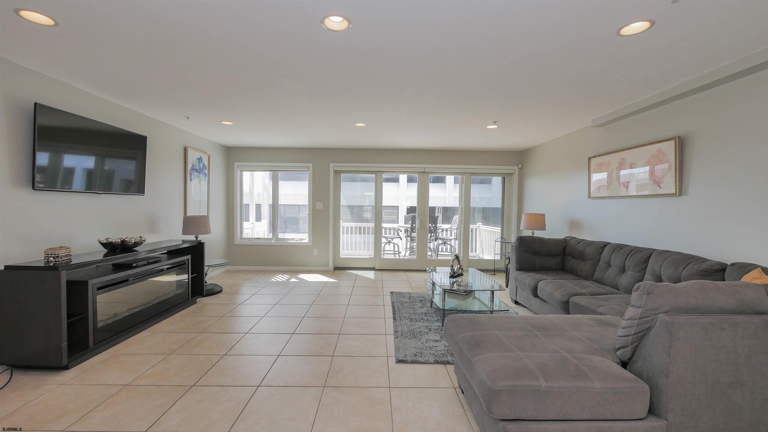 137 South Berkley Square, Unit B Atlantic City, NJ 08401 - Photo 5 of 42 a living room with furniture and a flat screen tv