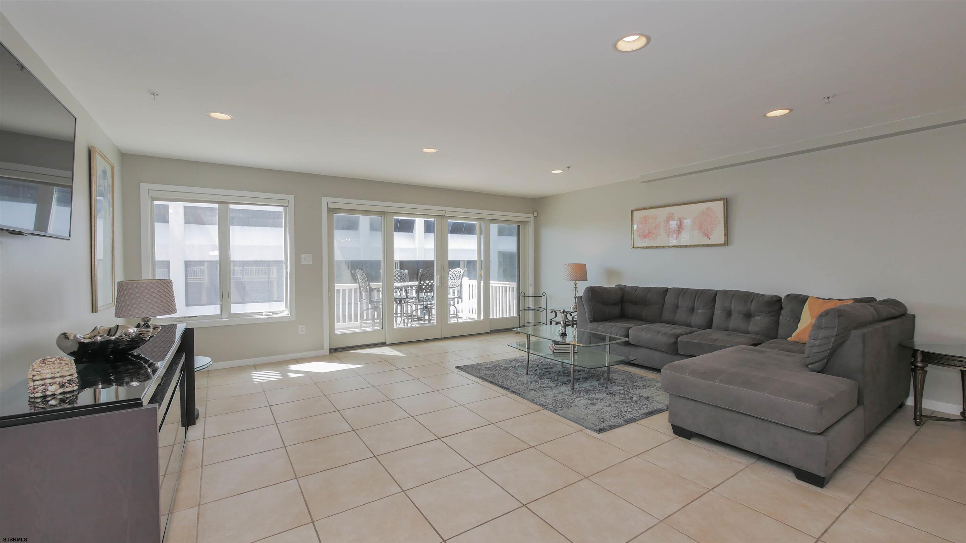 137 South Berkley Square, Unit B Atlantic City, NJ 08401 - Photo 6 of 42 a living room with furniture and a flat screen tv