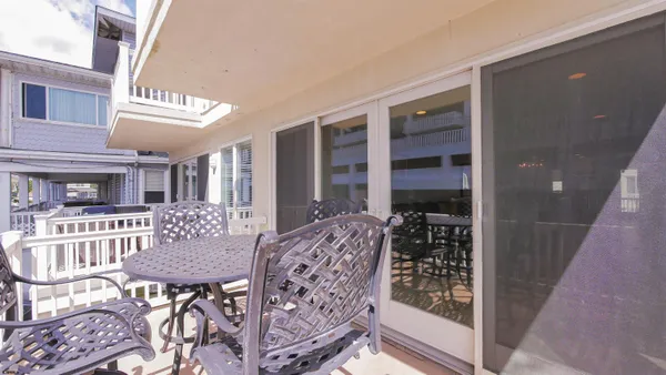 a kitchen with stainless steel appliances granite countertop a refrigerator and microwave