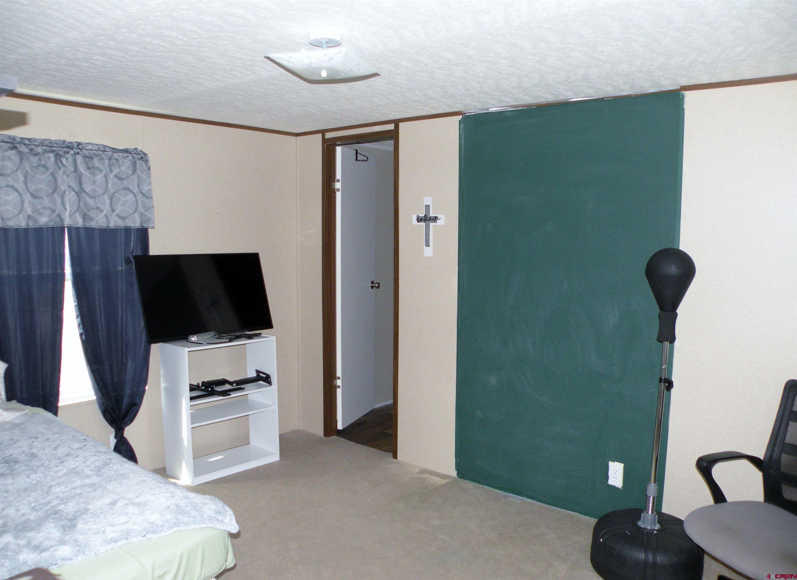 27936 CC Road Nucla, CO 81424 - Photo 4 of 10 a kitchen with a refrigerator and a stove top oven