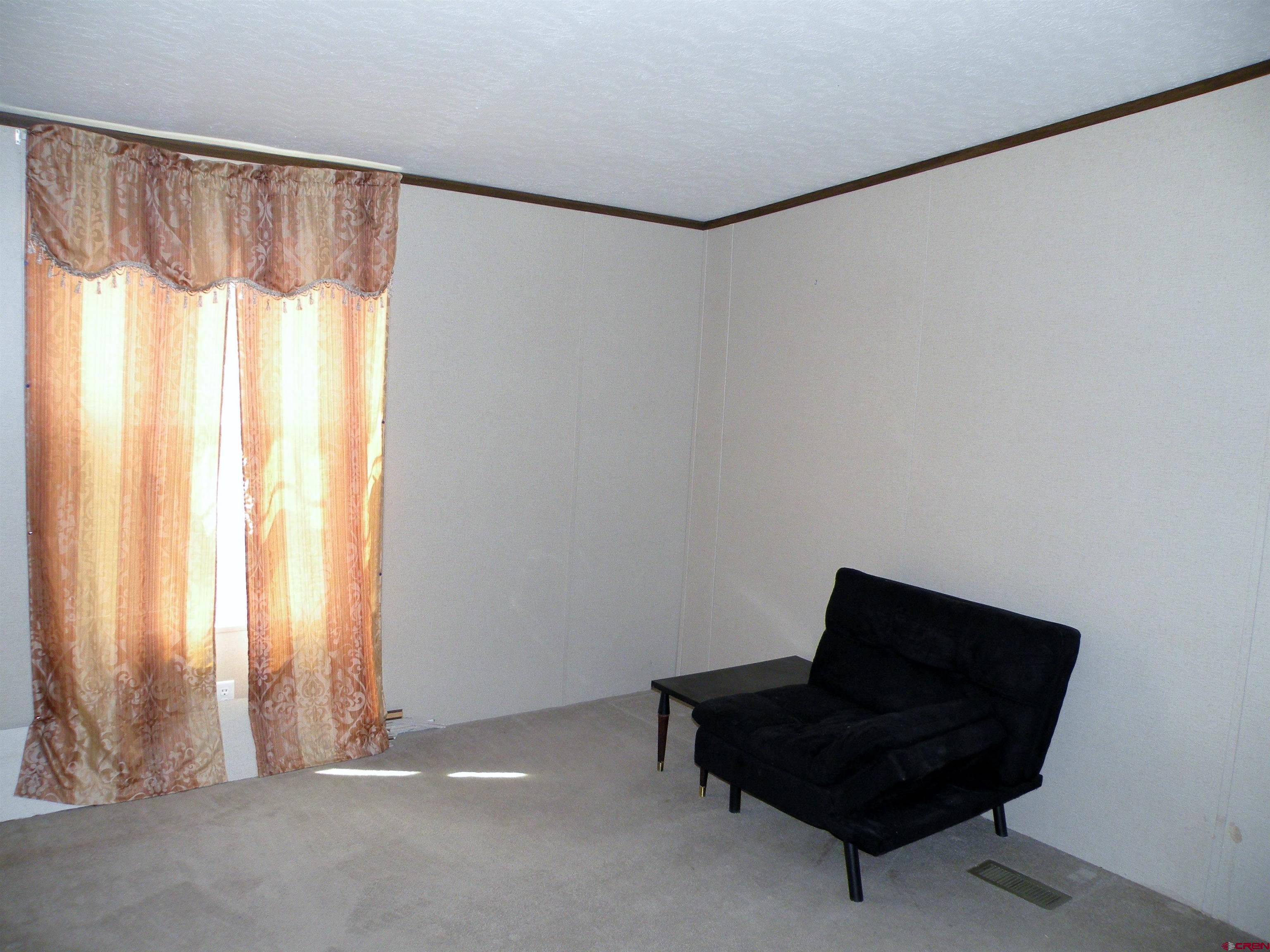 27936 CC Road Nucla, CO 81424 - Photo 7 of 10 a living room with furniture and a window