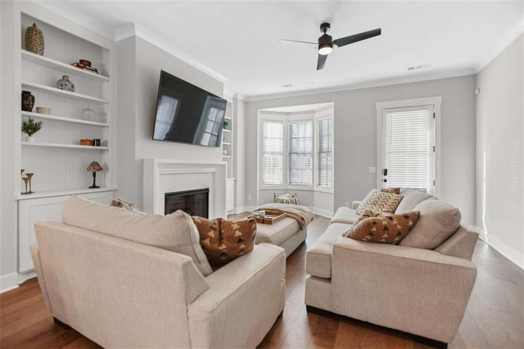 4466 Lemon Street Acworth, GA 30101 - Photo 13 of 65 a living room with furniture fireplace and flat screen tv