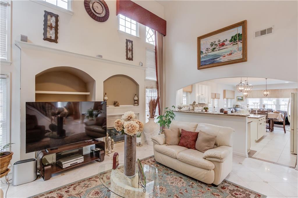 2648 Stockbridge Way Dacula, GA 30019 - Photo 13 of 59 a living room with furniture and a flat screen tv
