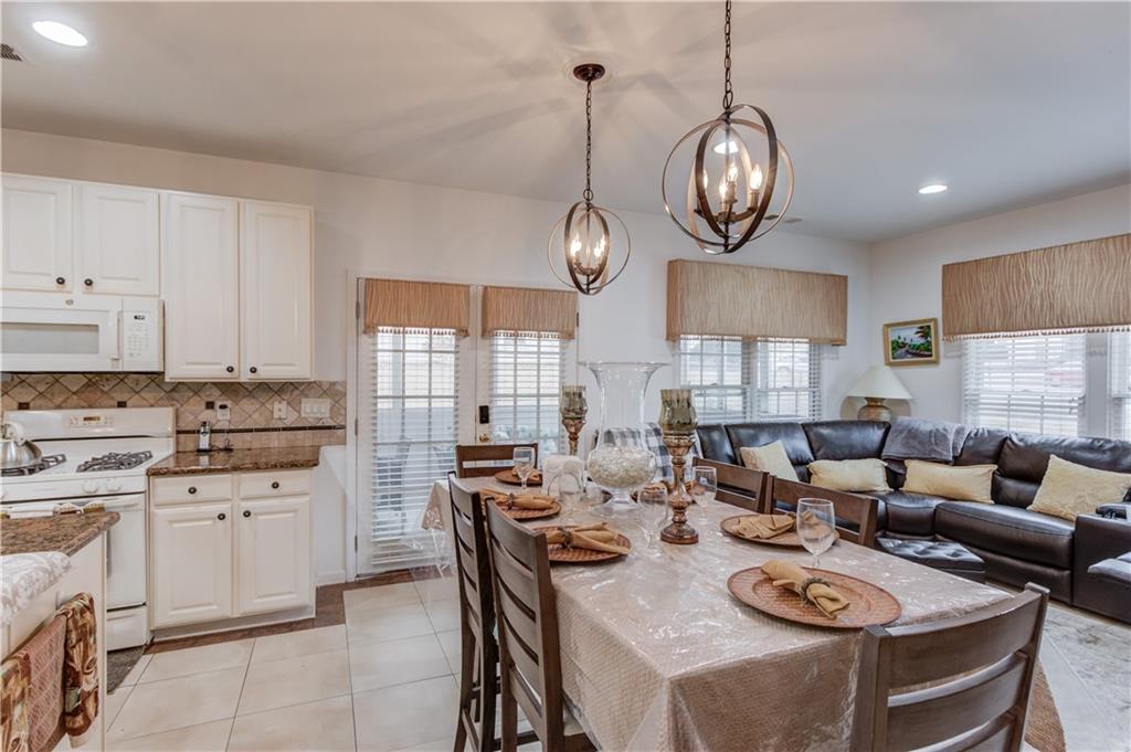 2648 Stockbridge Way Dacula, GA 30019 - Photo 20 of 59 a view of a dining room with furniture window and wooden floor
