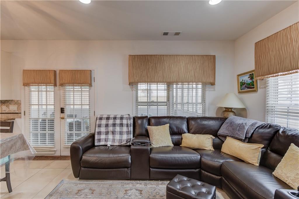 2648 Stockbridge Way Dacula, GA 30019 - Photo 22 of 59 a living room with furniture and a large window