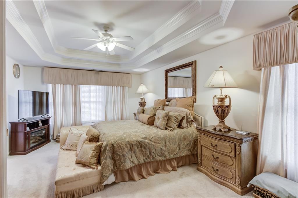 2648 Stockbridge Way Dacula, GA 30019 - Photo 28 of 59 a bedroom with a bed and wooden floor