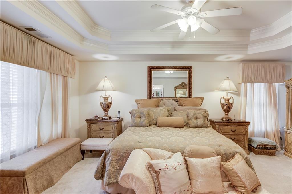 2648 Stockbridge Way Dacula, GA 30019 - Photo 29 of 59 a bedroom with a bed and wooden floor