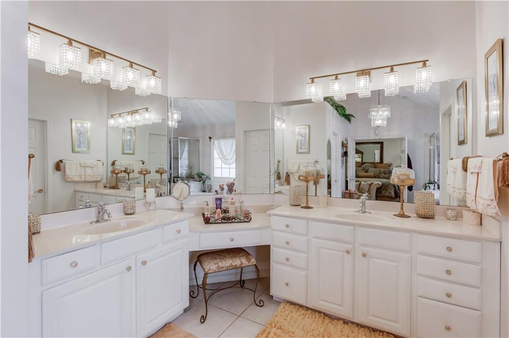 2648 Stockbridge Way Dacula, GA 30019 - Photo 32 of 59 a bathroom with a double vanity sink and a mirror