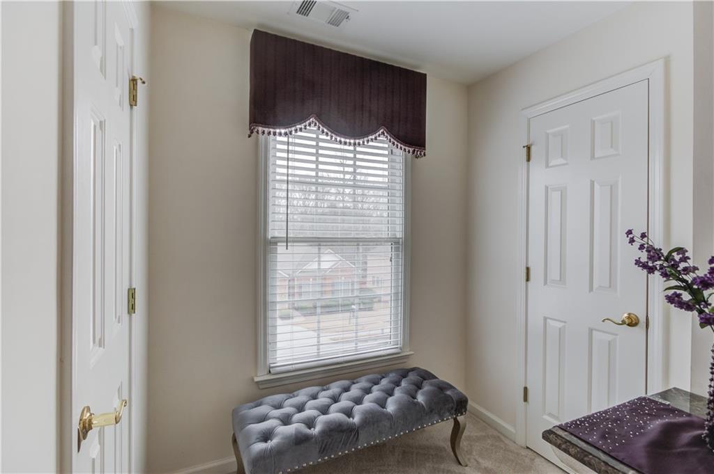 2648 Stockbridge Way Dacula, GA 30019 - Photo 36 of 59 a room with window and couch