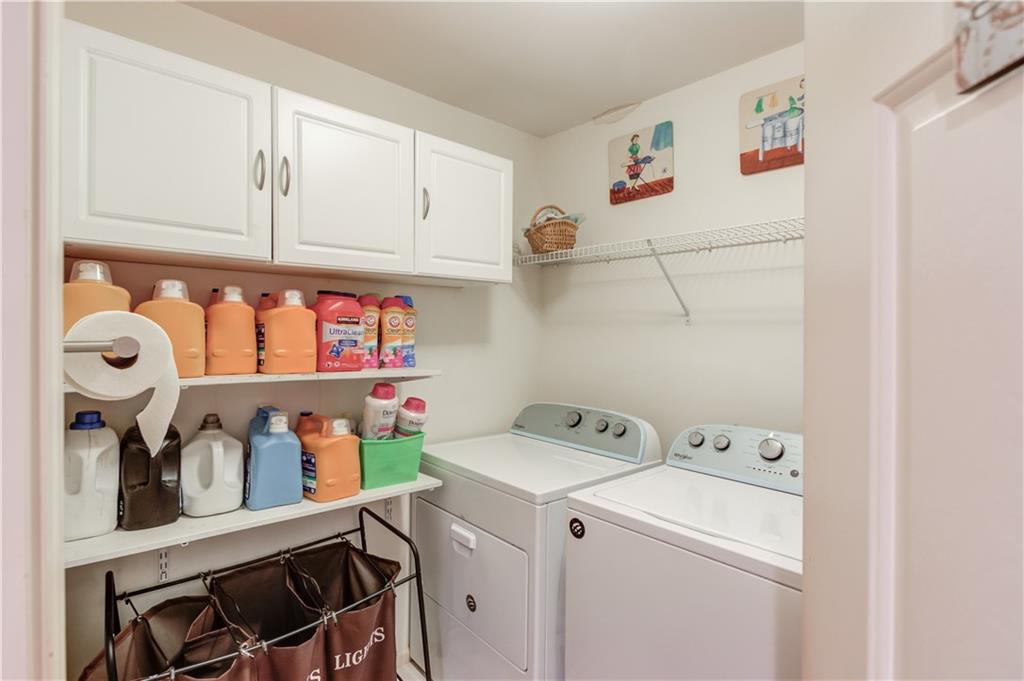 2648 Stockbridge Way Dacula, GA 30019 - Photo 44 of 59 a utility room with dryer and washer
