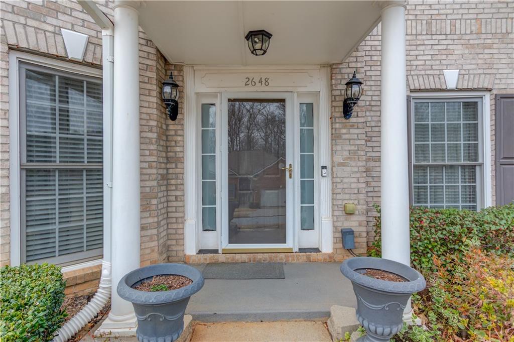 2648 Stockbridge Way Dacula, GA 30019 - Photo 5 of 59 a front view of a house with a fountain