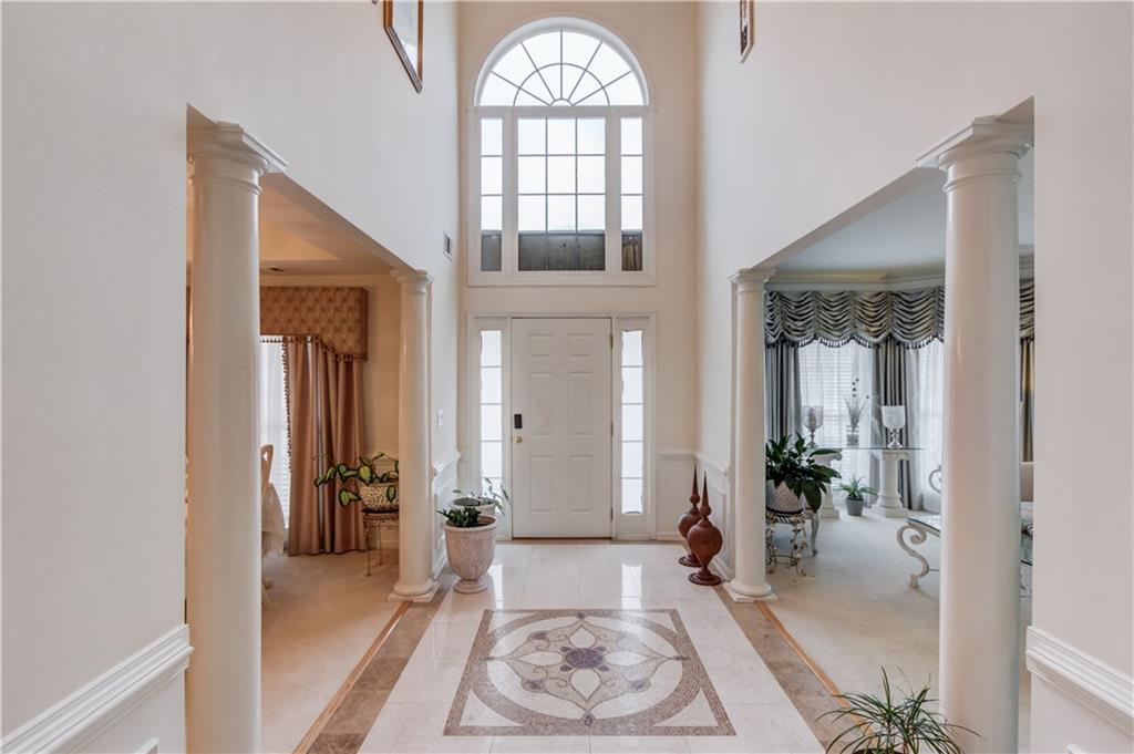 2648 Stockbridge Way Dacula, GA 30019 - Photo 7 of 59 a view of an entryway with wooden floor