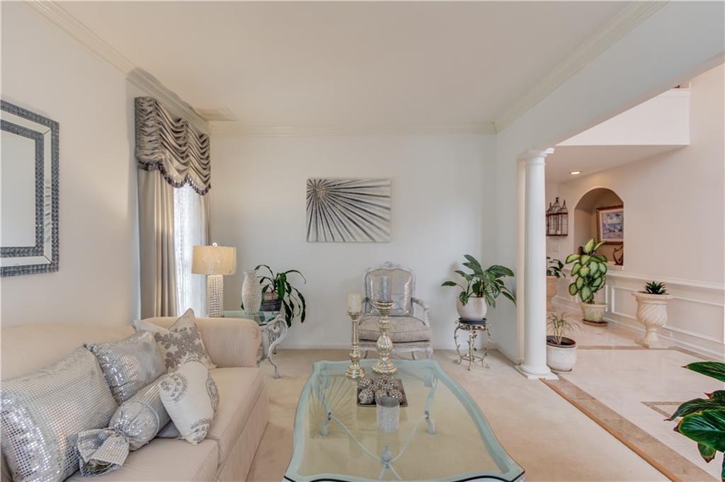 2648 Stockbridge Way Dacula, GA 30019 - Photo 9 of 59 a living room with furniture and potted plant