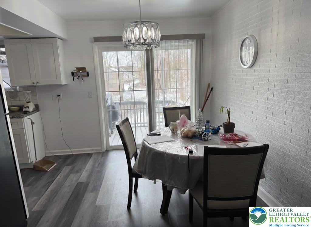162 Independence Road East Stroudsburg, PA 18301 - Photo 11 of 24 a view of a dining room with furniture window and wooden floor
