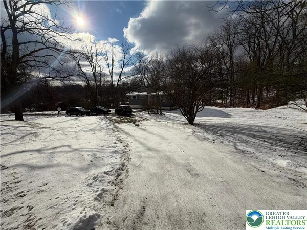 a view of snow on the road
