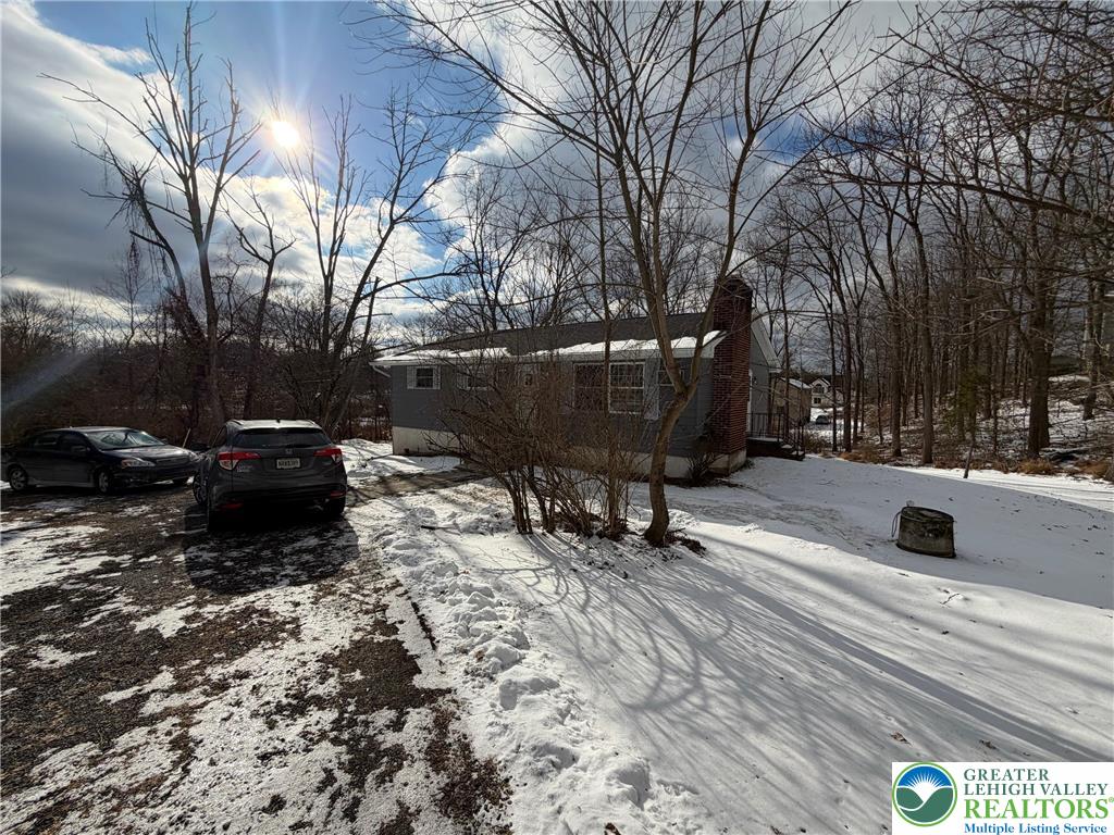 162 Independence Road East Stroudsburg, PA 18301 - Photo 5 of 24 a view of a back yard of the house with a bench