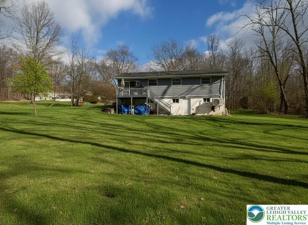 a view of a house with a big yard