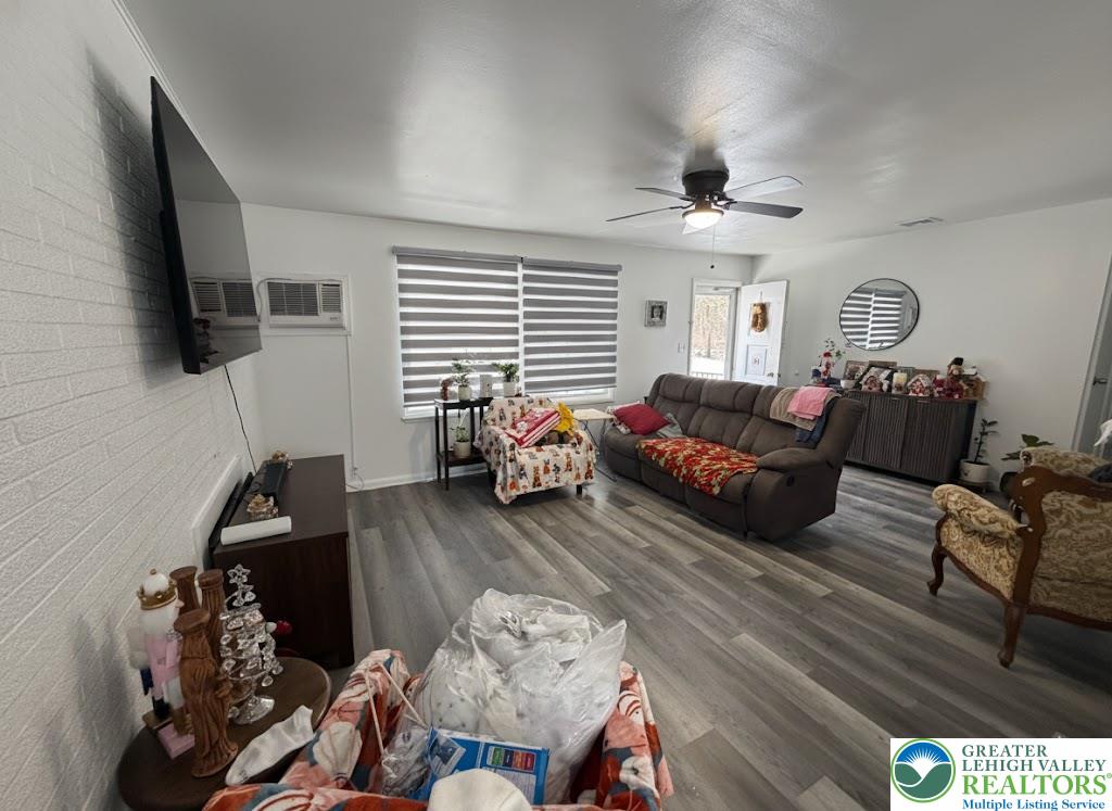 162 Independence Road East Stroudsburg, PA 18301 - Photo 10 of 24 a living room with furniture a flat screen tv and a window