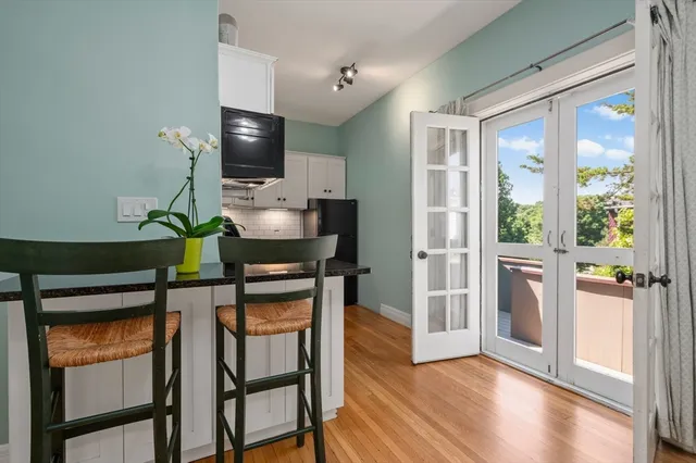 a view of room with furniture and wooden floor