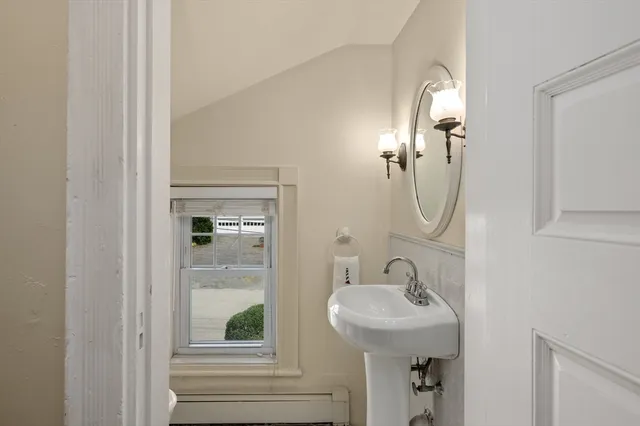 a bathroom with a sink and mirror