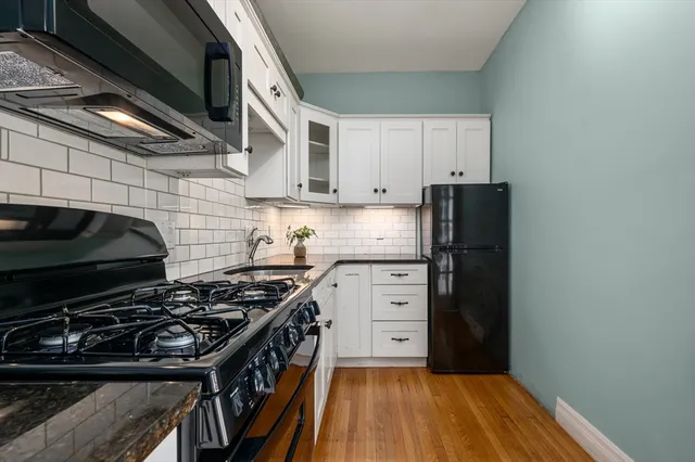 a kitchen with a stove and a refrigerator