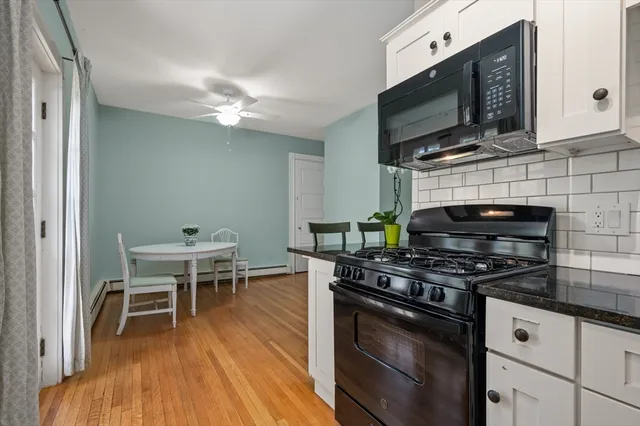 a kitchen with stainless steel appliances a stove a sink and a microwave