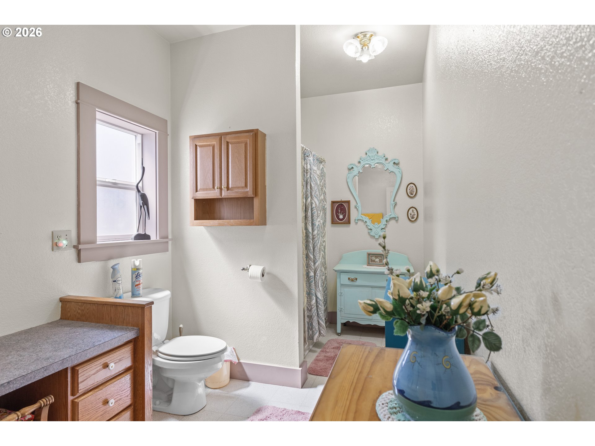 208 7th Street Myrtle Point, OR 97458 - Photo 29 of 48 a bathroom with a toilet sink and mirror