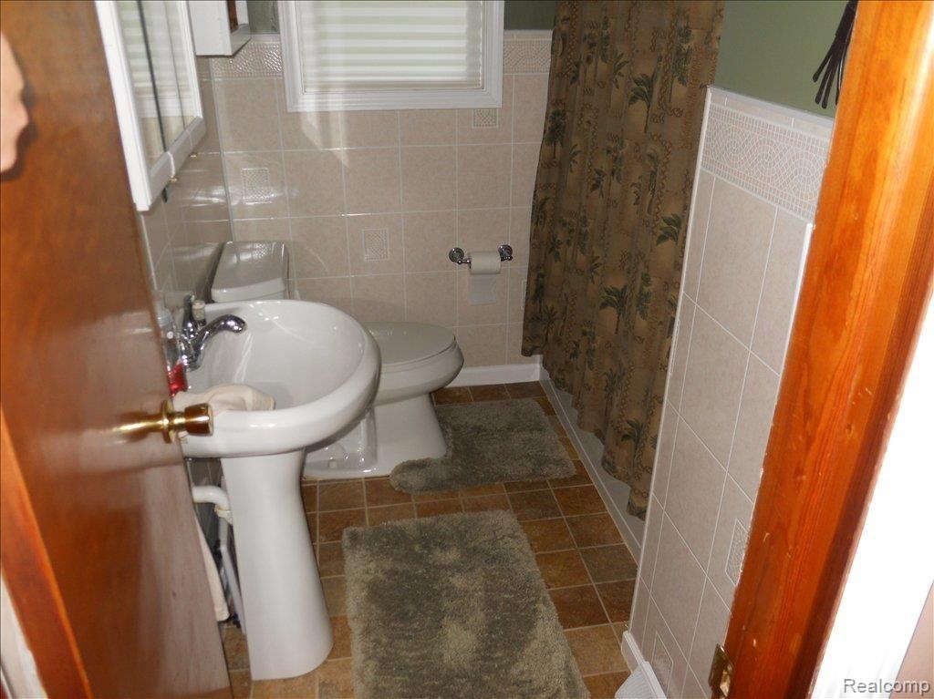 29 East Miller Road Sandusky, MI 48471 - Photo 13 of 16 Full Bath new tile floor.