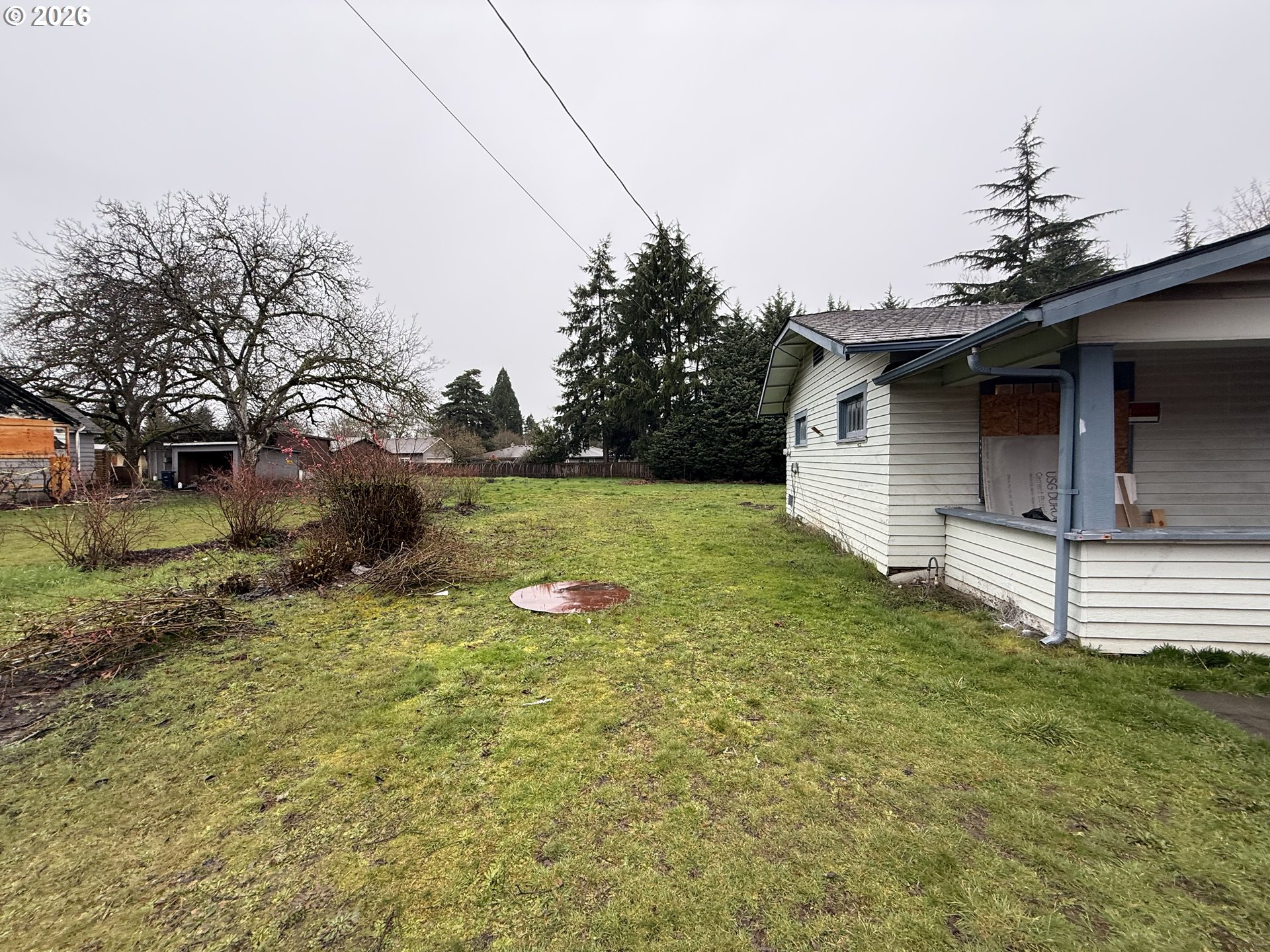 3945 Southwest 185th Avenue Beaverton, OR 97078 - Photo 18 of 26 a view of a backyard with plants and large tree